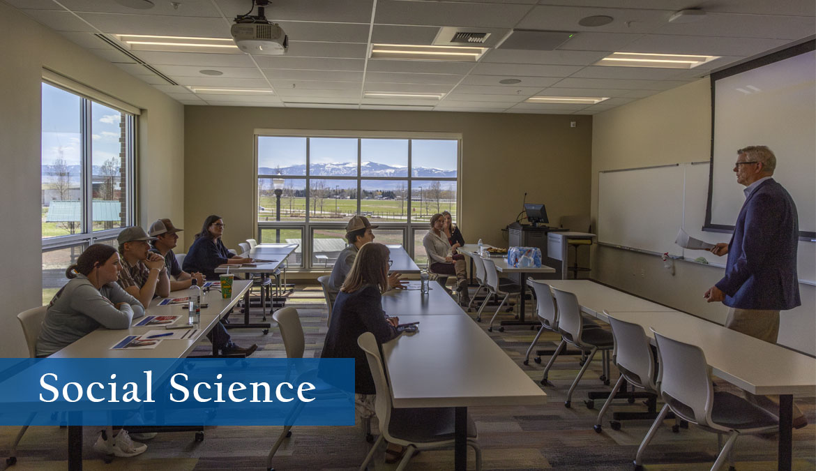 Social Science Classroom with students listening to a lecture with the bighorn mountains clearly visible out the window.